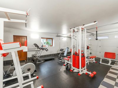 Minimalist home gym space with soft lighting and plants