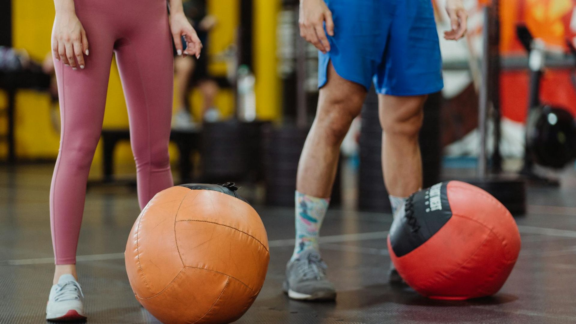Person doing dynamic movements in a modern gym setting